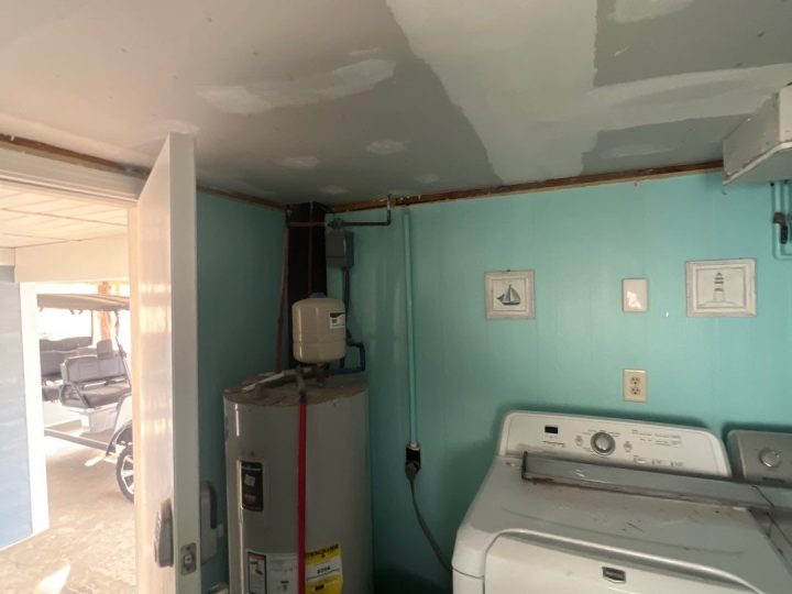 Ceiling drywall repair in progress in Oak Island, NC